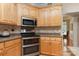 Spacious kitchen showcasing stainless steel appliances, a double oven, and lots of cabinets at 5283 Fieldstone Dr, Concord, NC 28025