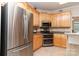 Kitchen featuring stainless steel appliances and light wood cabinets at 5283 Fieldstone Dr, Concord, NC 28025