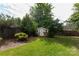 A charming backyard with a storage shed, lush lawn, and a privacy fence, ideal for relaxation and outdoor activities at 539 Marsh Rd, Charlotte, NC 28209