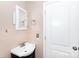 Bathroom featuring a vanity sink, framed mirror, and neutral wall colors at 539 Marsh Rd, Charlotte, NC 28209