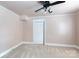 Bedroom with carpet, ceiling fan, and closet for ample storage space at 539 Marsh Rd, Charlotte, NC 28209