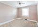 Cozy bedroom featuring a ceiling fan and window that provides natural light at 539 Marsh Rd, Charlotte, NC 28209