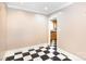 A bright dining room with checkerboard floors and access to the adjacent kitchen at 539 Marsh Rd, Charlotte, NC 28209