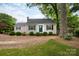 Classic home with a well-kept lawn, symmetrical landscaping, and a brick walkway leading to a welcoming front entrance at 539 Marsh Rd, Charlotte, NC 28209