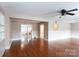 Spacious living room with hardwood floors, ceiling fan, and open floor plan at 539 Marsh Rd, Charlotte, NC 28209