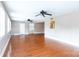 Large living room offers hardwood floors, multiple windows, and ceiling fans at 539 Marsh Rd, Charlotte, NC 28209