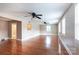 Spacious living room with hardwood floors, ceiling fans, and natural light at 539 Marsh Rd, Charlotte, NC 28209