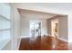 Open concept living room with hardwood floors and multiple entryways at 539 Marsh Rd, Charlotte, NC 28209