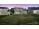 A beautiful backyard features a well-manicured lawn perfect for outdoor activities at 6135 Raisin Tree Ln, Charlotte, NC 28215