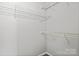 Walk-in closet features wire shelving, optimizing storage in a simple design at 6135 Raisin Tree Ln, Charlotte, NC 28215
