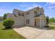 Spacious two-story home featuring a two-car garage, covered front porch, and well-manicured lawn at 6135 Raisin Tree Ln, Charlotte, NC 28215