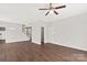 Spacious living area with hardwood floors and ample natural light, seamlessly connecting to other living spaces at 6135 Raisin Tree Ln, Charlotte, NC 28215