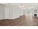 Spacious living room with hardwood floors, fireplace and French doors to the back yard at 6135 Raisin Tree Ln, Charlotte, NC 28215