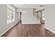 Bright living room featuring hardwood floors, recessed lighting, and staircase at 6135 Raisin Tree Ln, Charlotte, NC 28215