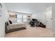 Cozy bedroom with a neutral color scheme, carpet, and versatile space for work or relaxation at 6145 Holland St, Fort Mill, SC 29707