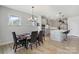 Modern kitchen and dining area with stainless steel appliances and pendant lighting at 6145 Holland St, Fort Mill, SC 29707
