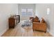 Cozy living room featuring hardwood floors, two leather chairs and a stylish beverage center at 6145 Holland St, Fort Mill, SC 29707