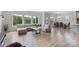 Bright living space featuring hardwood floors, large windows, and comfortable seating at 6145 Holland St, Fort Mill, SC 29707