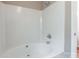Relaxing bathroom showcasing a bathtub with white tile and fixtures at 6622 Cedar Cliff Dr, Charlotte, NC 28216
