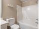 Standard bathroom with a white shower-tub combination, standard toilet, and neutral wall color at 6622 Cedar Cliff Dr, Charlotte, NC 28216