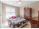 Comfortable bedroom with a queen-sized bed, plush carpeting, and a bright window at 6622 Cedar Cliff Dr, Charlotte, NC 28216