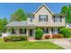 Charming two-story home featuring a welcoming front porch and beautiful landscaping at 6622 Cedar Cliff Dr, Charlotte, NC 28216