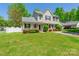 Charming two-story home featuring a welcoming front porch and beautiful landscaping at 6622 Cedar Cliff Dr, Charlotte, NC 28216