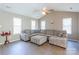 Spacious living room with vaulted ceilings, recessed lighting, and gray plank flooring at 6622 Cedar Cliff Dr, Charlotte, NC 28216