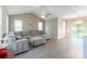 Spacious living room with vaulted ceilings, recessed lighting, and gray plank flooring at 6622 Cedar Cliff Dr, Charlotte, NC 28216