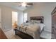 Comfortable main bedroom with a ceiling fan, carpet, and natural light at 6622 Cedar Cliff Dr, Charlotte, NC 28216