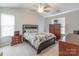 Comfortable main bedroom with a ceiling fan, carpet, and natural light at 6622 Cedar Cliff Dr, Charlotte, NC 28216