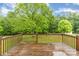 An idyllic back deck is surrounded by the lush greenery of the yard at 6769 Highway 557 None, Clover, SC 29710