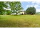 Expansive backyard with lush green grass and mature trees, offering a serene outdoor space at 6769 Highway 557 None, Clover, SC 29710