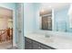 A vanity area with a large mirror and a shower stall area are seen in the bathroom at 6769 Highway 557 None, Clover, SC 29710