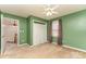 Basic bedroom with green walls, carpet flooring, closet and a ceiling fan at 6769 Highway 557 None, Clover, SC 29710