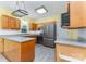 Traditional kitchen with stainless appliances, wood cabinets, tile backsplash and a view of the garden at 6769 Highway 557 None, Clover, SC 29710