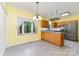 Bright eat-in kitchen with wood cabinetry, stainless steel appliances, and a large window view at 6769 Highway 557 None, Clover, SC 29710