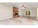 Cozy living room featuring a brick fireplace, carpet flooring, and natural light through glass doors at 6769 Highway 557 None, Clover, SC 29710