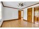 Spacious bedroom featuring hardwood floors, white walls with wood trim, and a ceiling fan at 704 Colby Cir, Salisbury, NC 28147