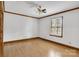 Bright bedroom with hardwood floors, plantation shutters, and white walls with wood trim at 704 Colby Cir, Salisbury, NC 28147