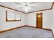 Bedroom featuring soft carpet, a window with blinds, and a classic wood door at 704 Colby Cir, Salisbury, NC 28147