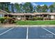 Well-kept home featuring a manicured lawn, ample parking, and visible 'For Sale' signage at 704 Colby Cir, Salisbury, NC 28147
