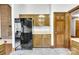 Cozy kitchen featuring oak cabinets and modern black stainless steel appliances at 704 Colby Cir, Salisbury, NC 28147
