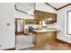 Functional kitchen featuring wood cabinetry, breakfast bar, and modern appliances at 704 Colby Cir, Salisbury, NC 28147
