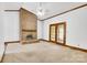Living room featuring a brick fireplace, carpet, and glass doors leading to outside at 704 Colby Cir, Salisbury, NC 28147