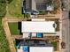 Aerial view of the home featuring a rooftop pool, modern architecture, and manicured landscaping at 721 Charles Ave, Charlotte, NC 28205