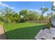 Large, well-maintained backyard with lush green lawn and a wooden privacy fence at 721 Charles Ave, Charlotte, NC 28205