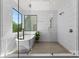 Modern bathroom with a soaking tub, walk-in shower, and bright window at 721 Charles Ave, Charlotte, NC 28205