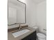 Bathroom features a modern vanity, toilet, and large mirror at 721 Charles Ave, Charlotte, NC 28205
