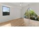 Bright bedroom with large windows, hardwood floors, and ample natural light at 721 Charles Ave, Charlotte, NC 28205